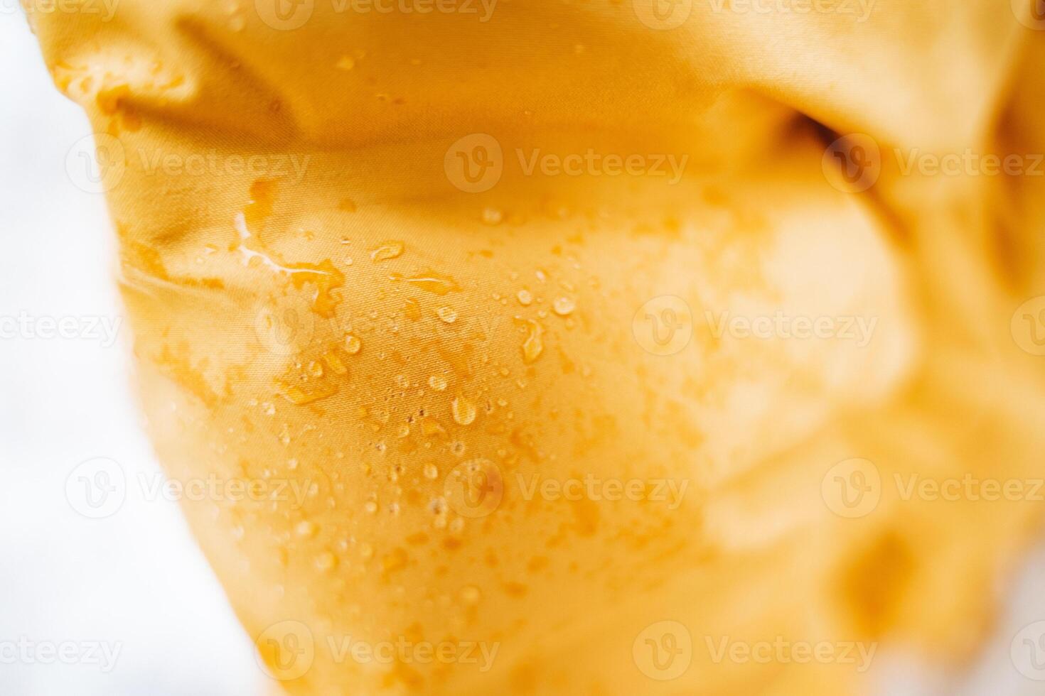 Here is a detailed closeup view of a piece of food, showing the intricate details along with water droplets resting beautifully on its surface, creating an appealing visual photo