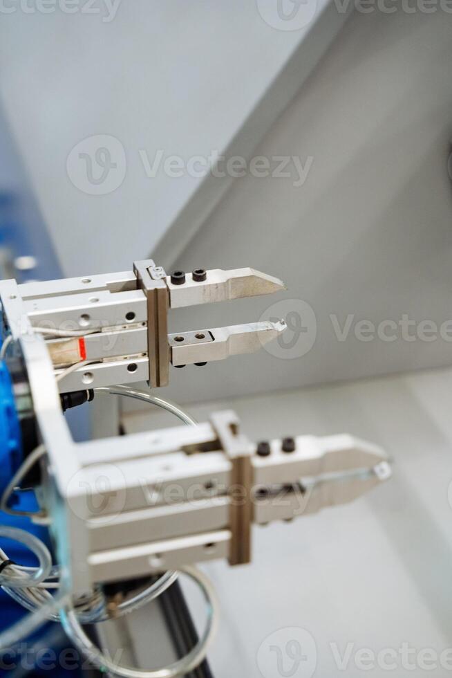 A detailed close up of a highly advanced robotic arm that features sharp and precise claws designed for intricate tasks and operations in various fields of engineering and manufacturing photo
