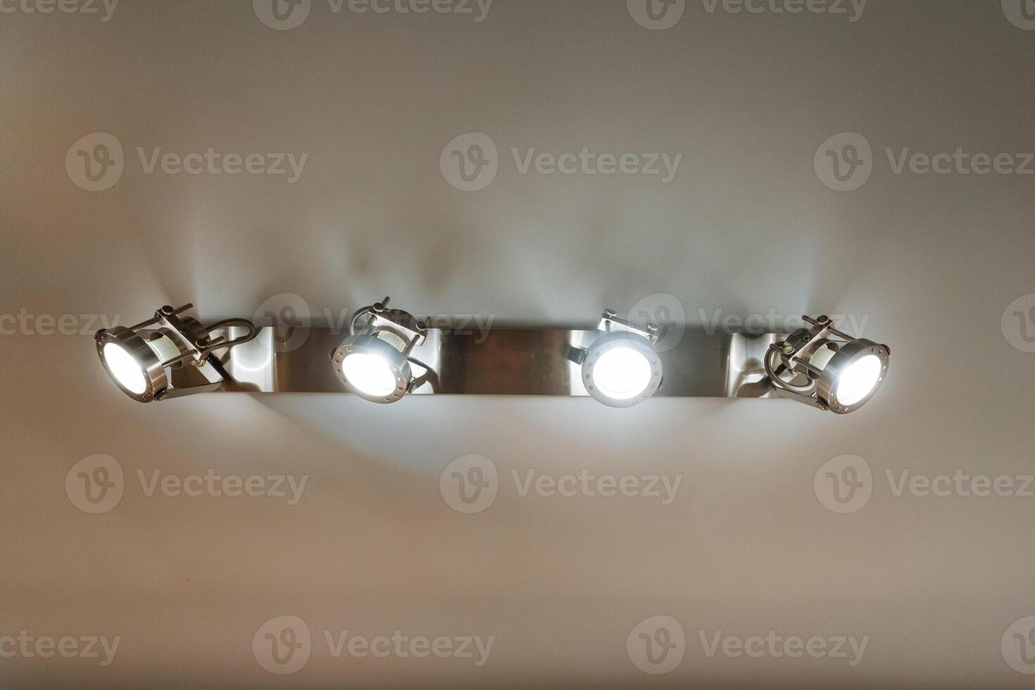 A beautiful row of colorful lights is elegantly hanging on the wall, adding a unique touch of atmosphere and vibrancy to the overall surroundings and enhancing the visual appeal photo