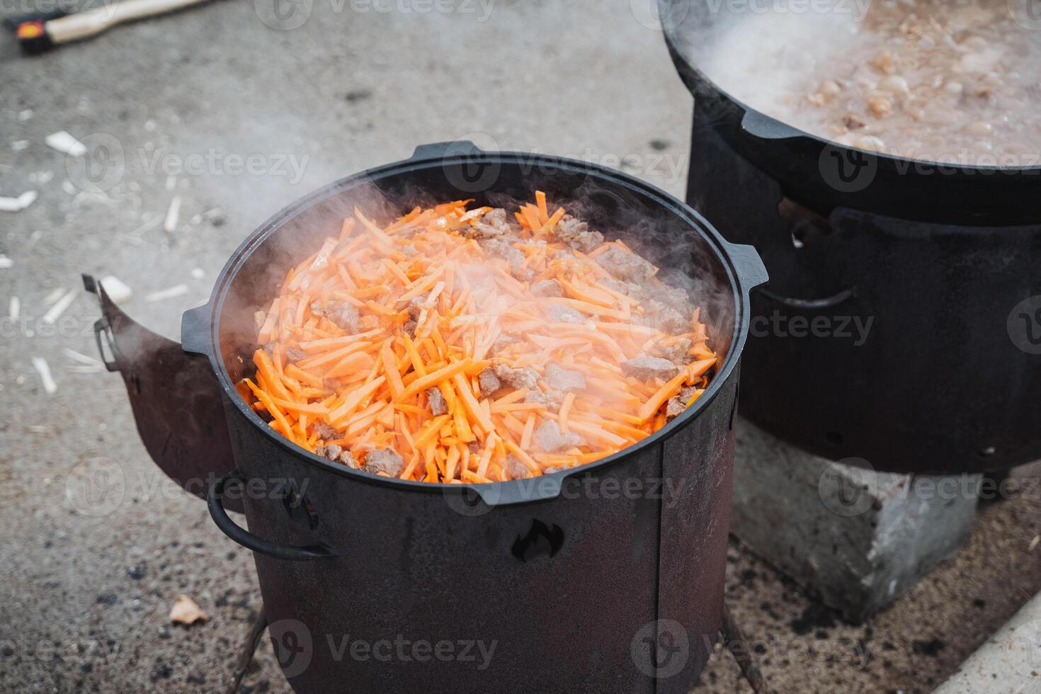 A pot filled with fresh, vibrant carrots is currently being cooked in boiling water on the stove, ensuring that they will be perfectly prepared for a delicious and healthy dish to enjoy photo