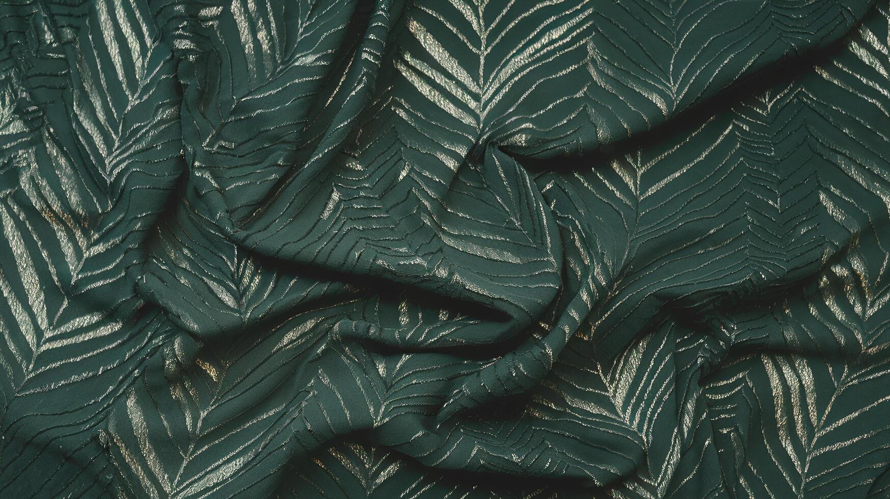 Green Fabric with Gold Leaf Pattern Background for Luxury and Elegant Design Projects photo