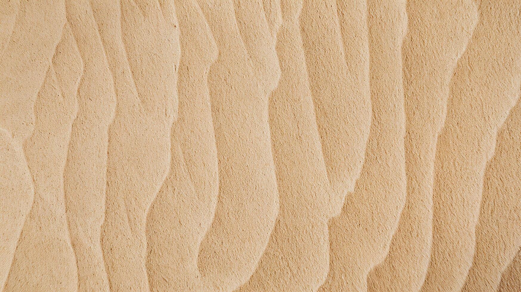 Natural Beige Sand Texture with Wavy Patterns Representing Desert Landscape and Serenity photo