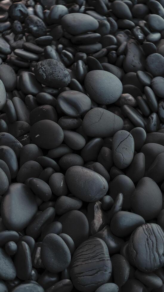 Smooth Black Pebbles Texture Close Up Natural Rounded Stones in Dark Tones Abstract Background photo