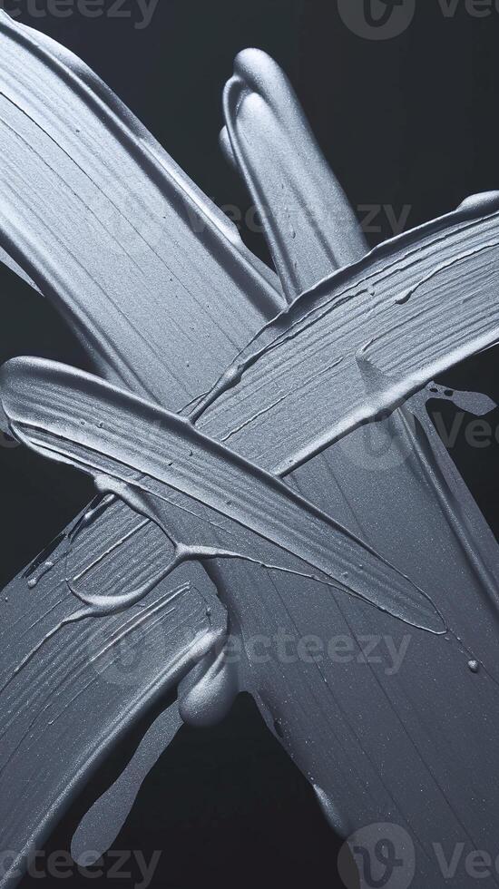 Abstract Metallic Silver Paint Strokes on Dark Background Expressing Creativity and Texture photo