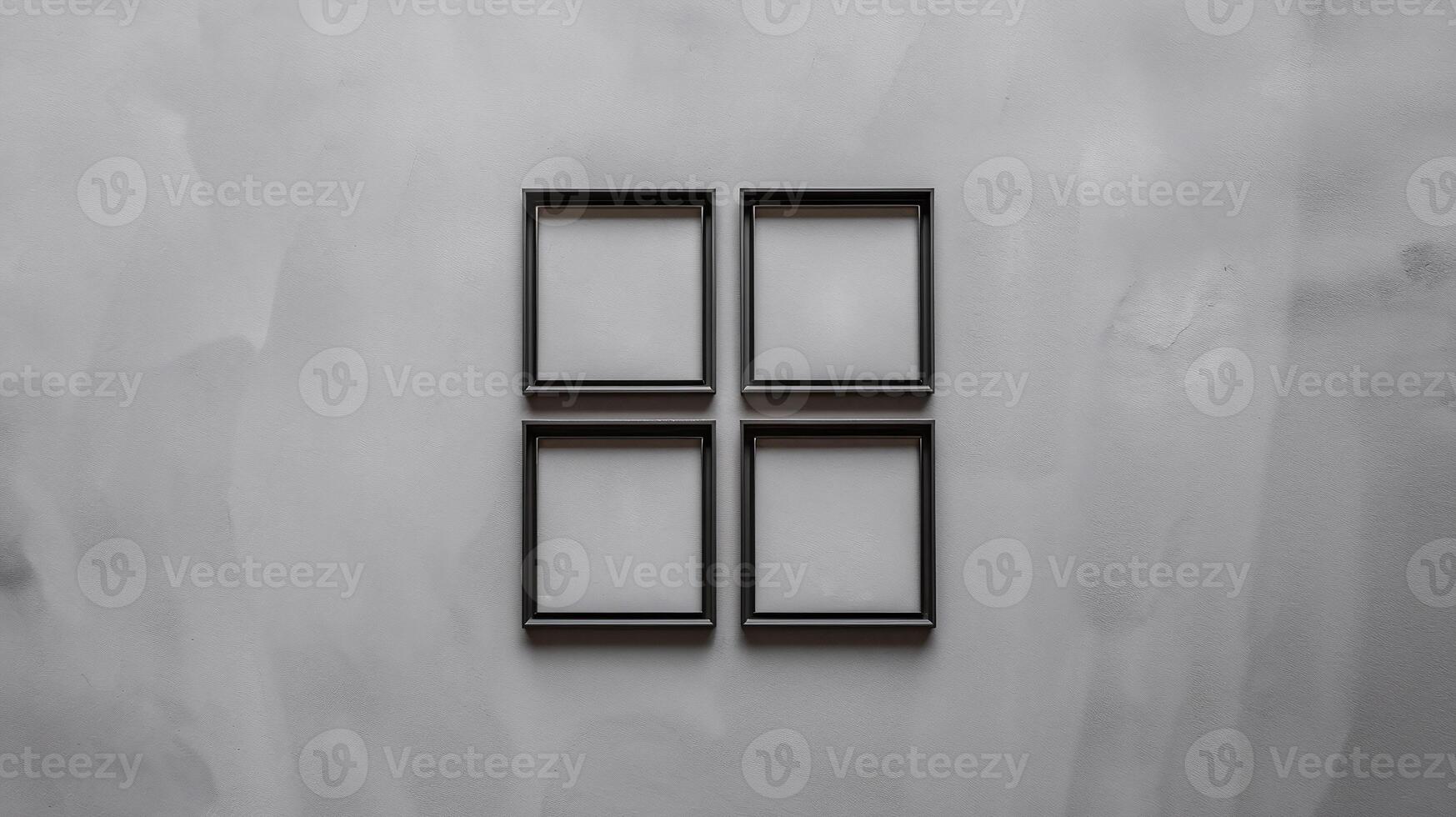 Minimalist Four Empty Black Picture Frames on Gray Textured Wall Background photo
