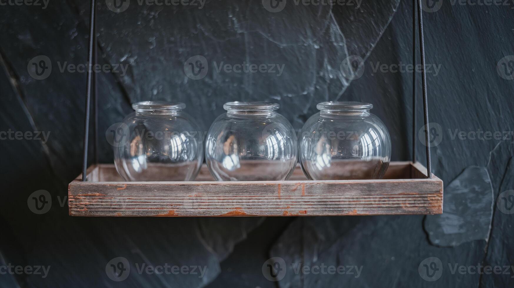 Rustic Wooden Shelf Holding Empty Glass Jars Against Dark Slate Wall Minimalist Design photo