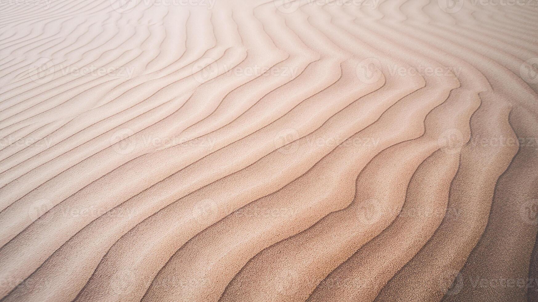 Closeup View of Wavy Desert Sand Dunes with Natural Patterned Texture and Warm Beige Tones photo