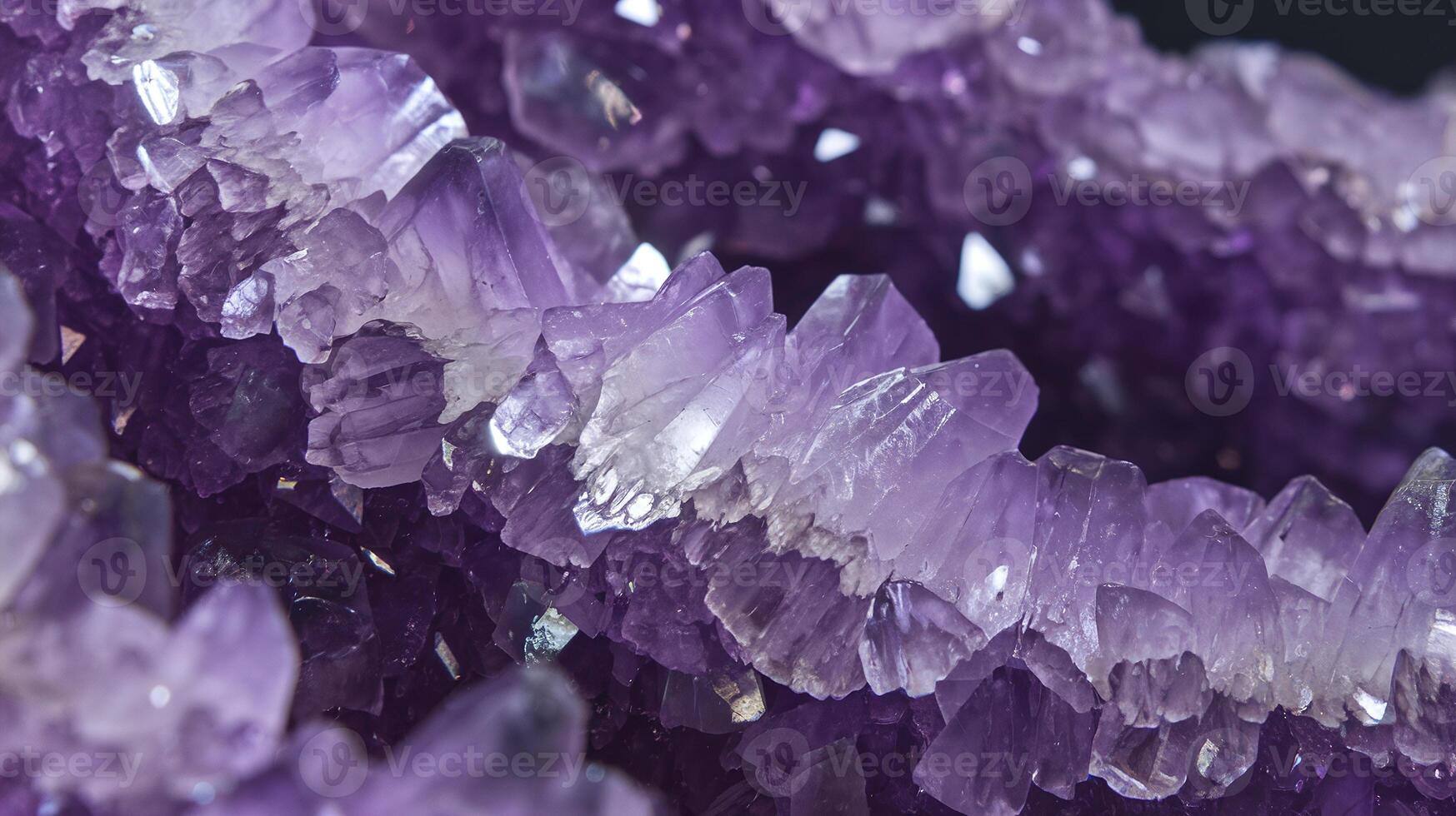 Closeup of Purple Amethyst Crystal Cluster with Sharp Faceted Edges and Shimmering Surfaces photo