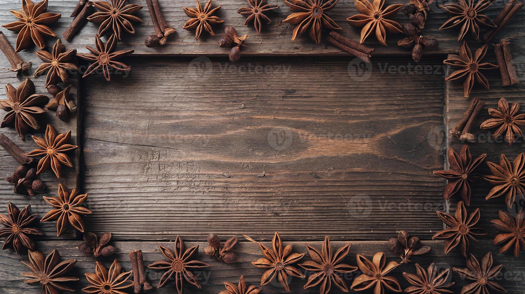 Rustic Wooden Background Framed with Star Anise Cinnamon Cloves for Food Spices Concept photo