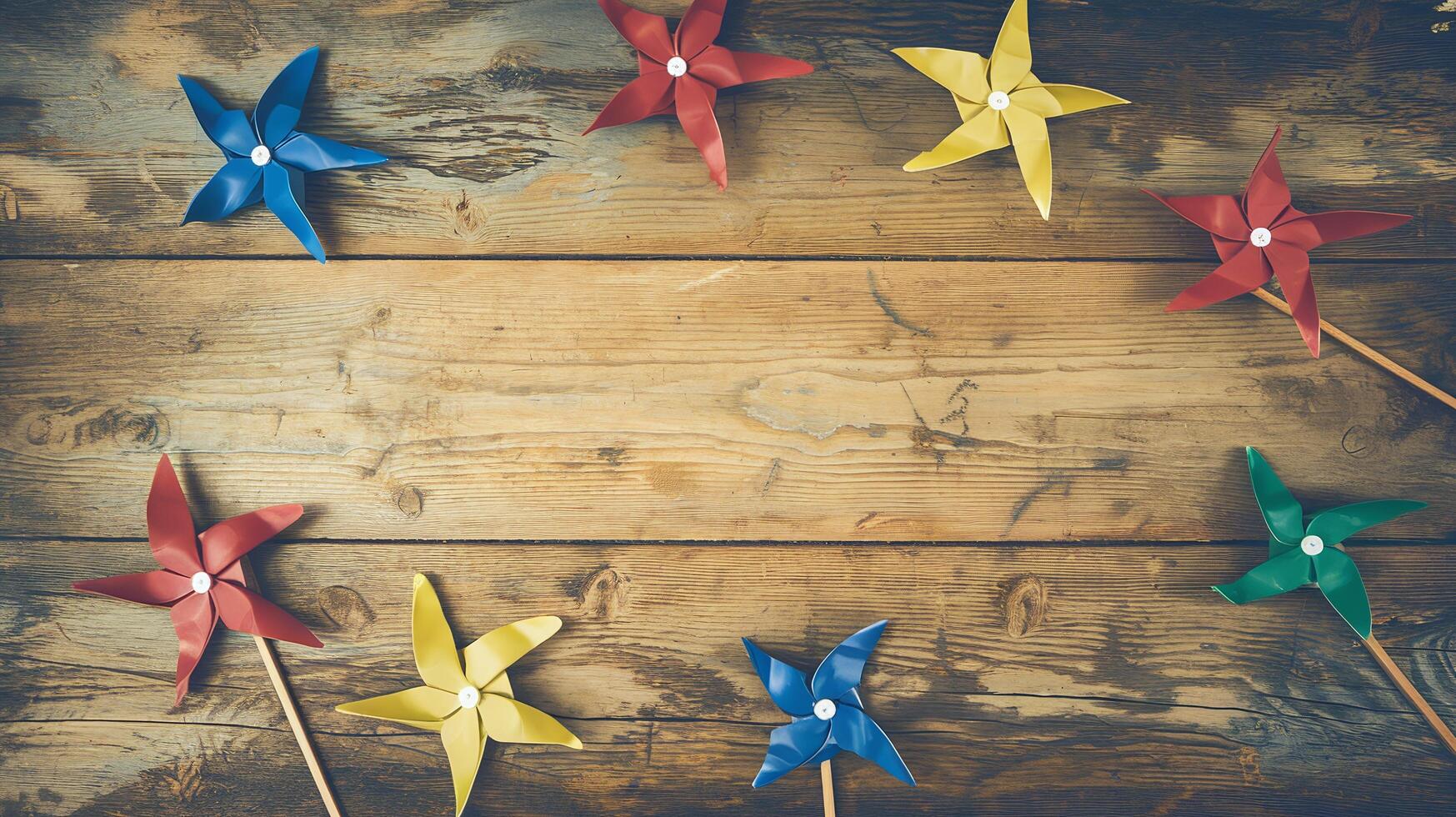 Colorful Pinwheel Toys Arranged in Circle on Rustic Wooden Surface Celebrating Fun and Playfulness photo