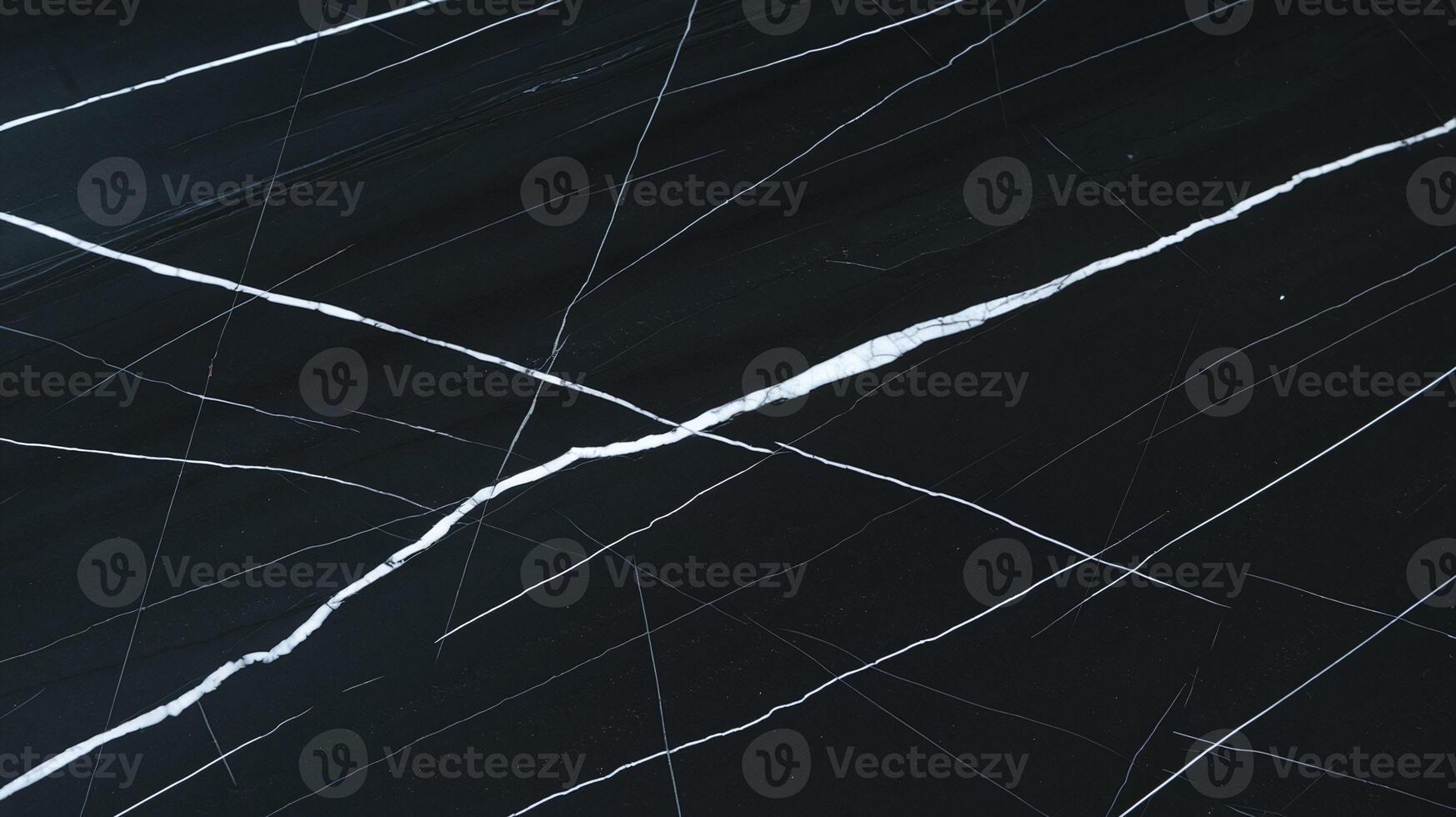 Abstract black marble surface with white natural cracks modern textured pattern background design photo