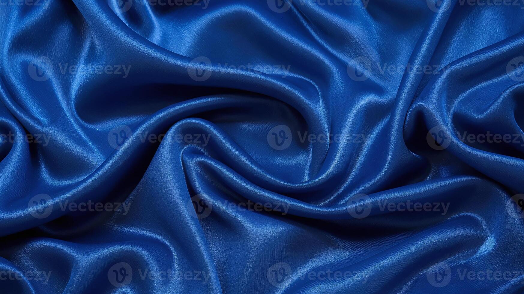 Vibrant blue luxurious silk fabric with smooth folds and shiny texture for elegant backgrounds photo