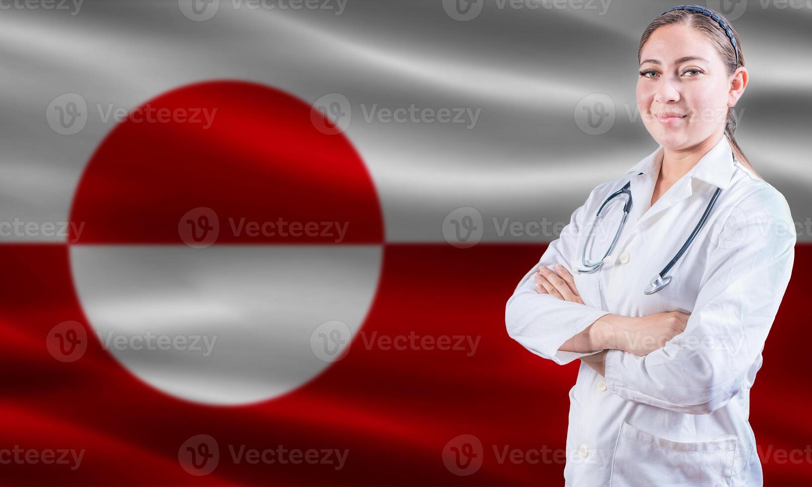 Female doctor on Greenland flag. Doctor with crossed arms on Greenland flag. Greenland Health and Care concept photo