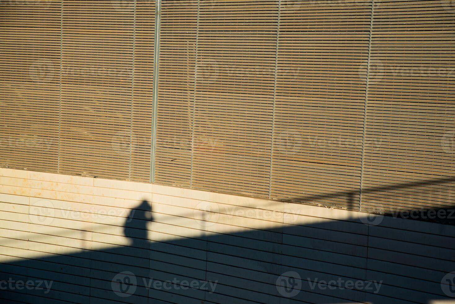 Shadow of a person reflected on the wall. photo