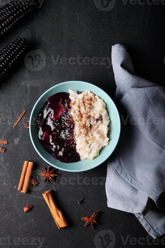 Top view of a Peruvian dessert called Arroz con leche y mazamorra morada. photo