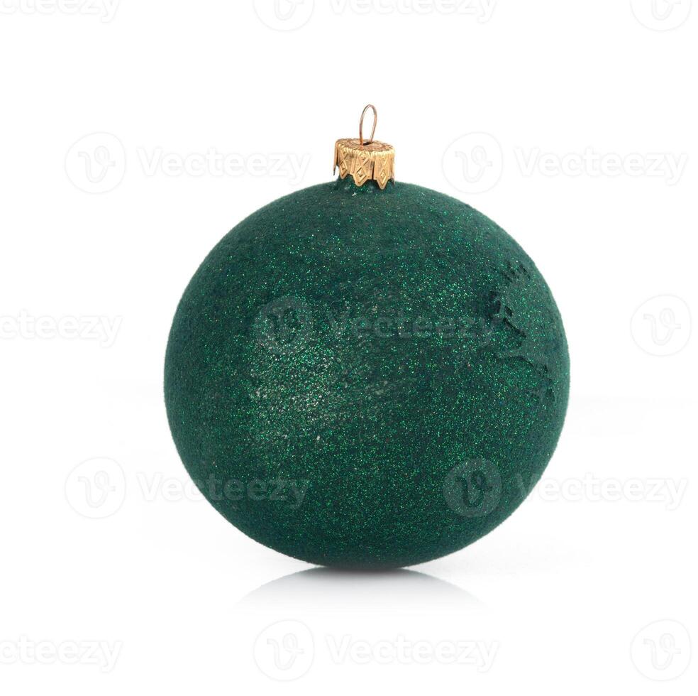 Green glittery Christmas bauble with a golden cap, isolated on a white background photo