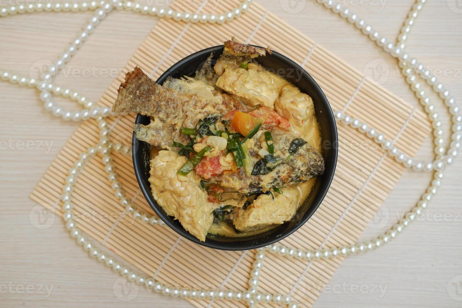 Fish curry with a super delicious combination of tempeh and tofu photo