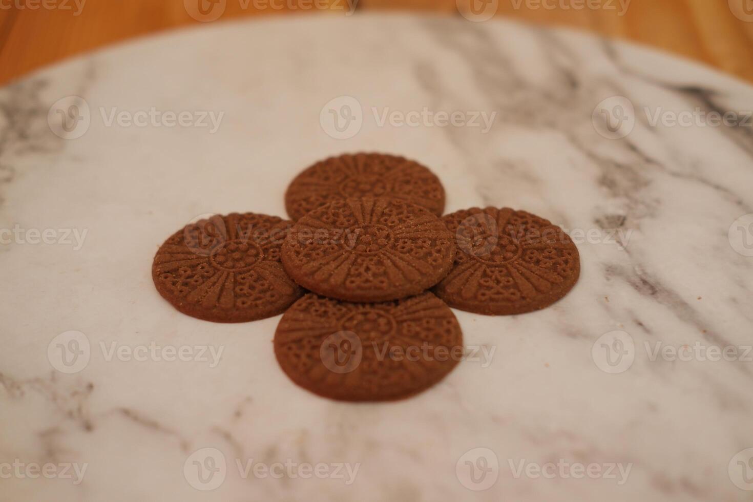 Cookies on a marble, neatly arranged photo
