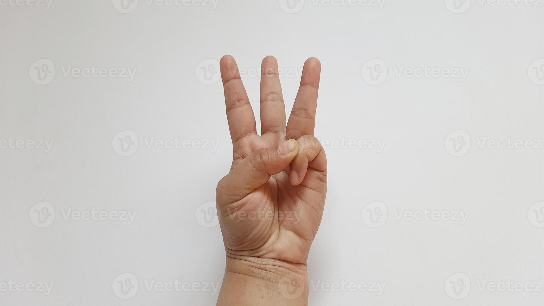 A woman hand showing three number isolated on white background photo