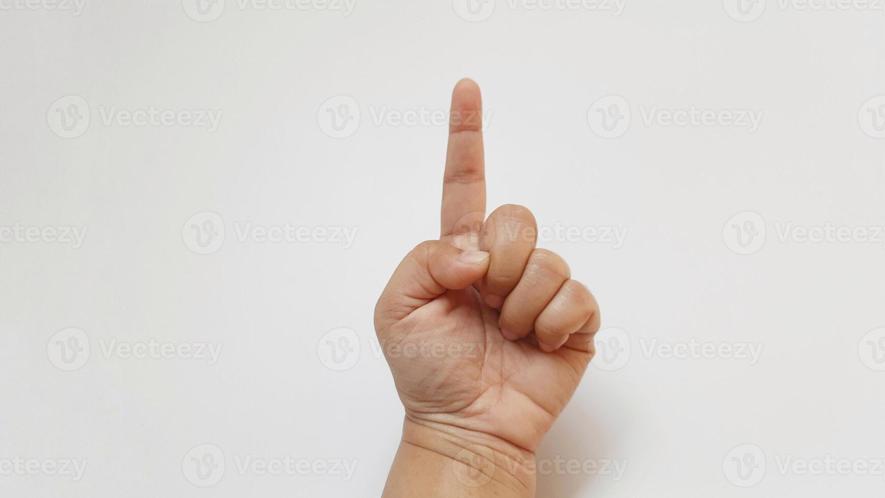 A woman hand forefinger something up photo
