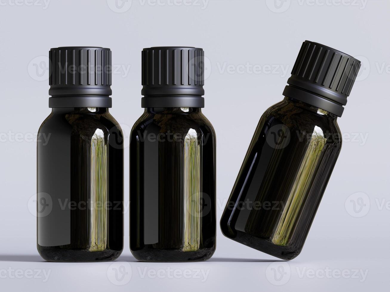 Three black bottles with different sizes of essential oils photo