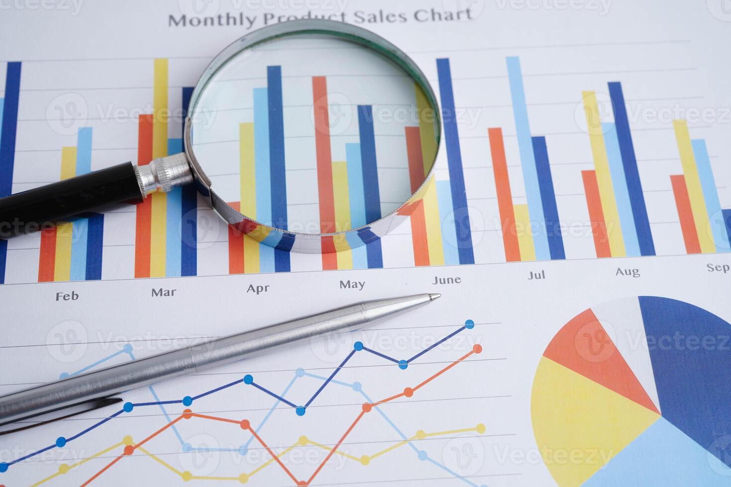 Magnifying glass on charts graphs paper. Financial development, Banking Account, Statistic, Investment Analytic research data economy. photo