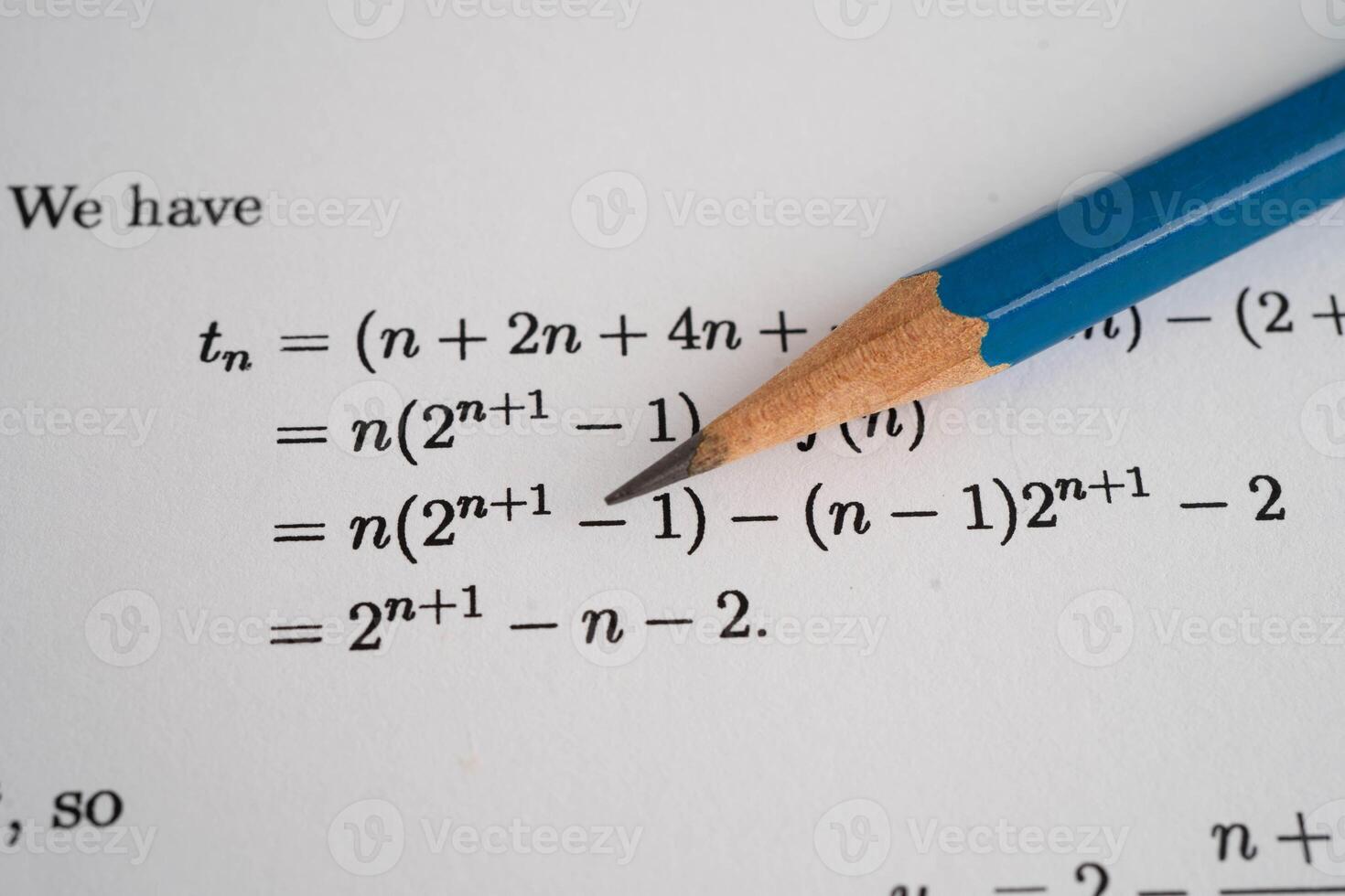 Pencil on mathematic formula exercise test paper in education school. photo