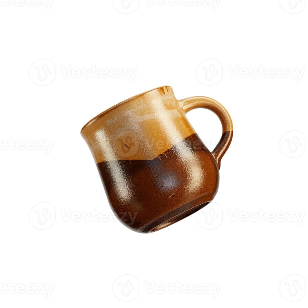 A uniquely designed drinking glass in shades of brown and yellow, set against a white backdrop. photo