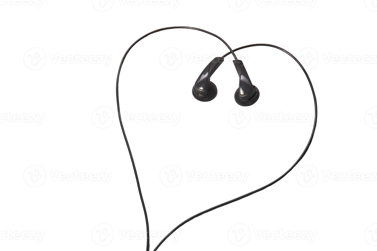 Black earbuds forming heart shape on white background, symbolizing love for music and connectivity. photo