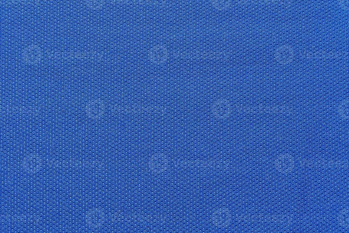 Close up textured blue fabric surface with knitted pattern. photo