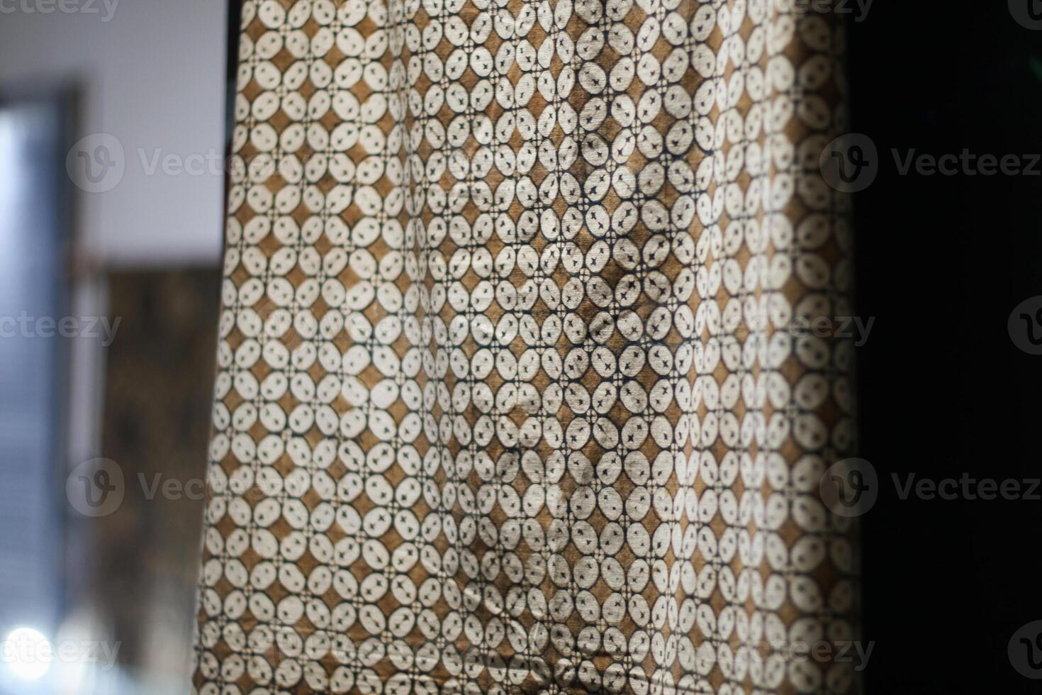 one of the typical Indonesian batik cloth motifs called the Kawung motif is being hung. photo