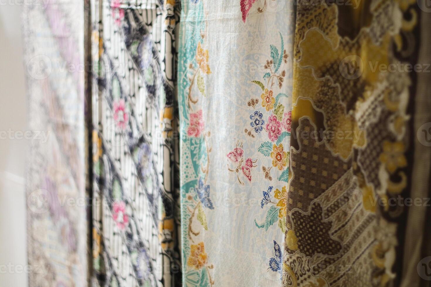 The beautiful and close up photo of batik cloth, with various motifs and colors.