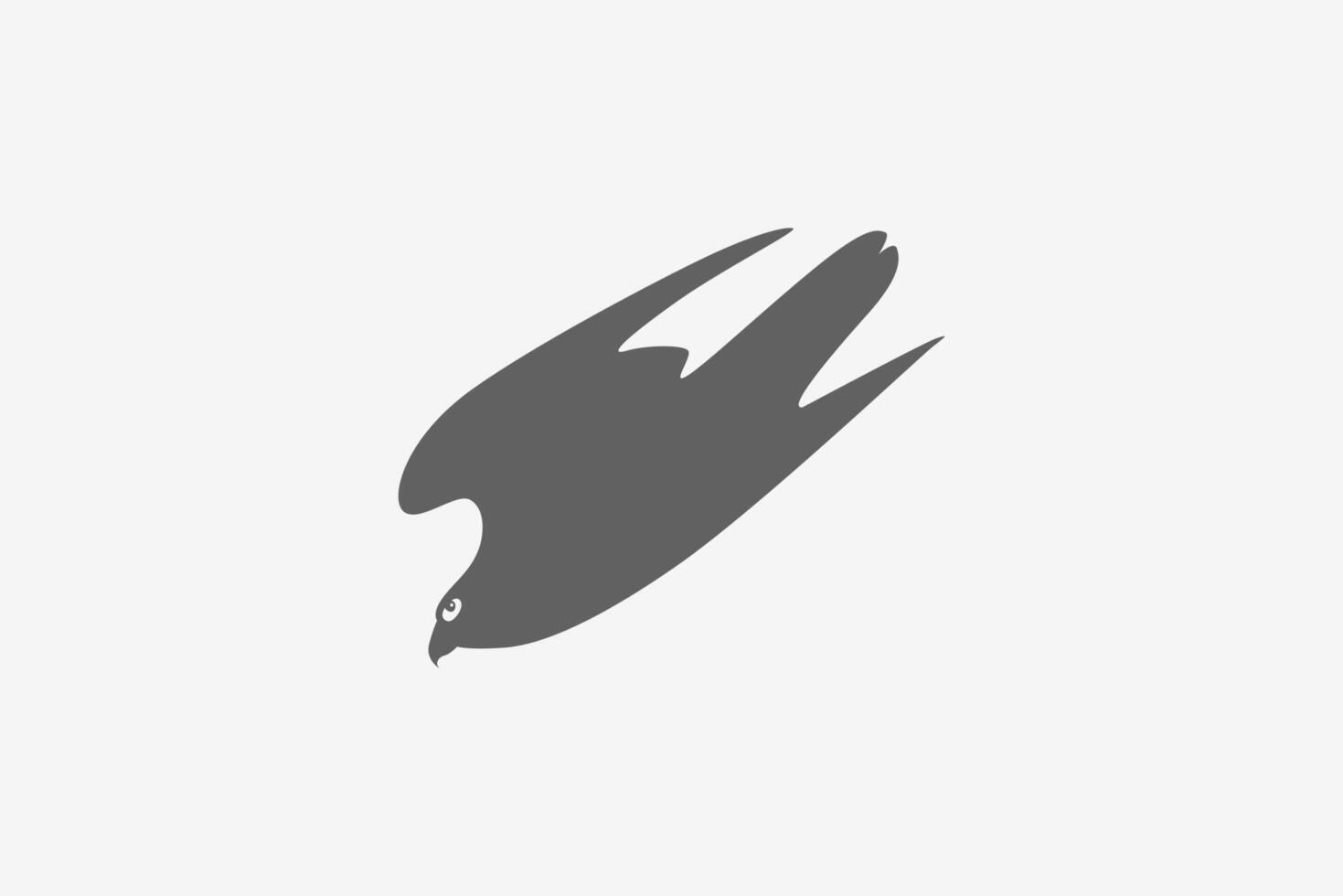Solid falcon move down with wild tail and wings silhouette logo vector