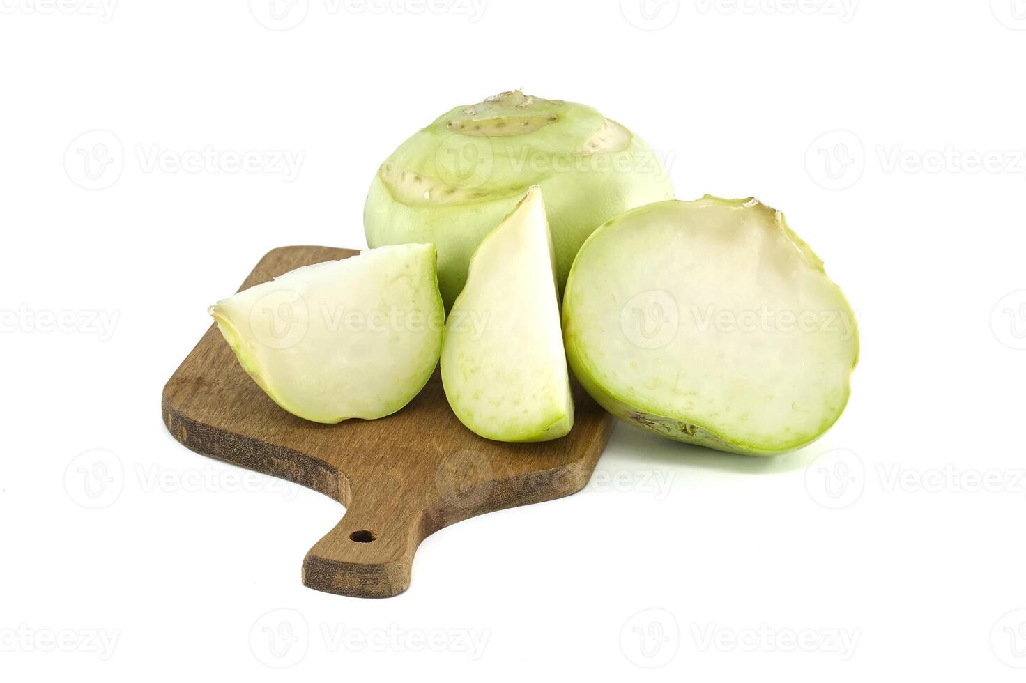 Fresh Kohlrabi on a Cutting Board with Slices Visible photo