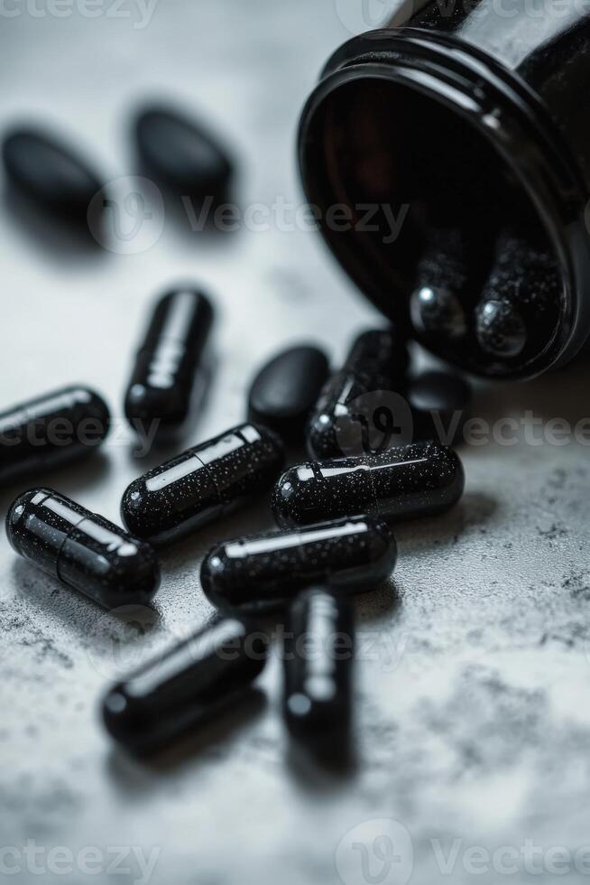 Black capsules spilled from a bottle on a textured surface in a natural light photo
