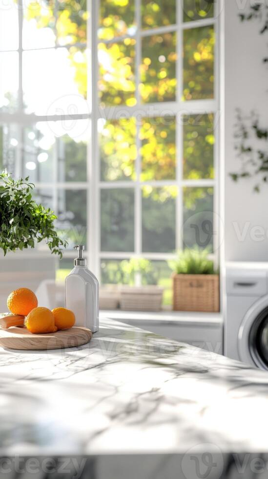 Bright and airy kitchen with fresh oranges on a marble countertop photo