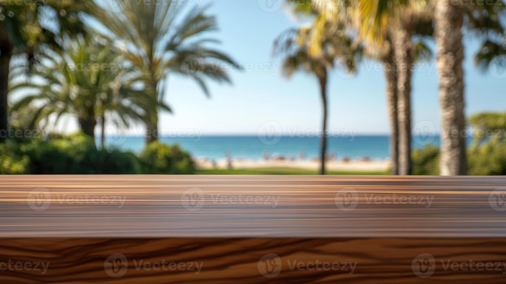 Coastal view with palm trees and a wooden table overlooking the beach photo