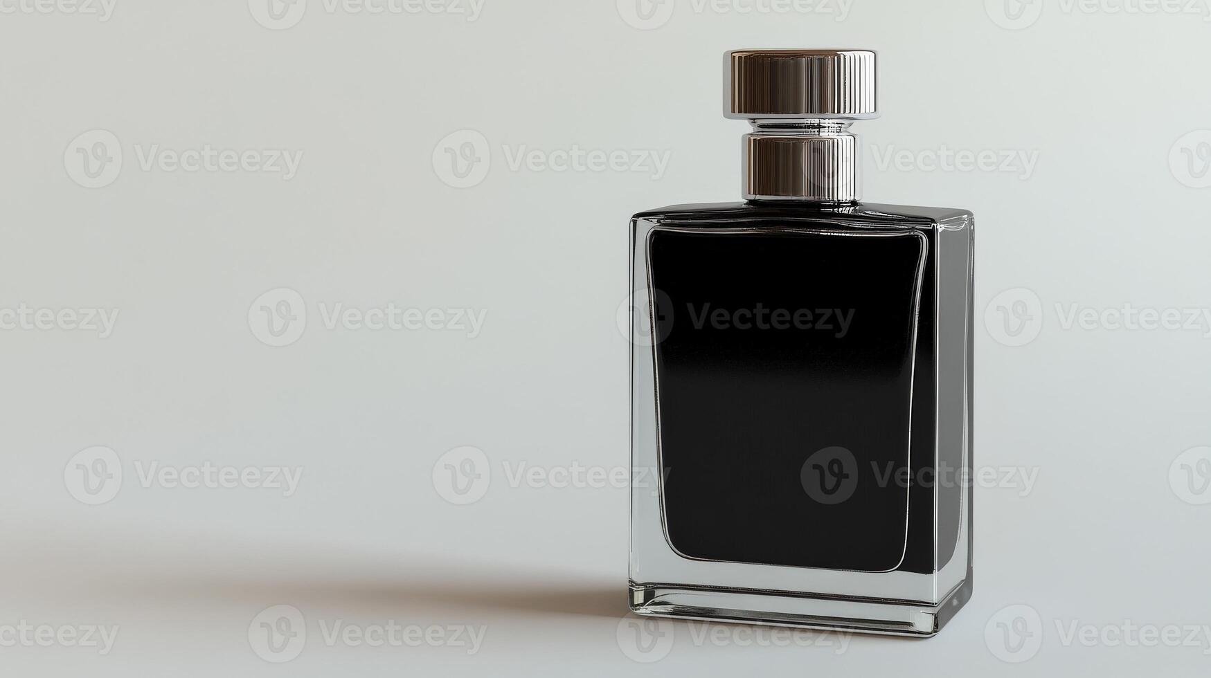 Sleek black perfume bottle with silver accents on minimalistic background photo
