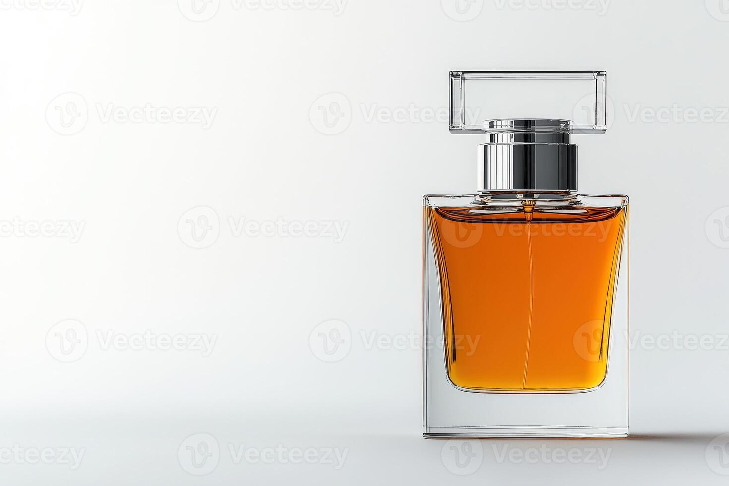 Elegant glass perfume bottle with amber liquid on neutral background photo