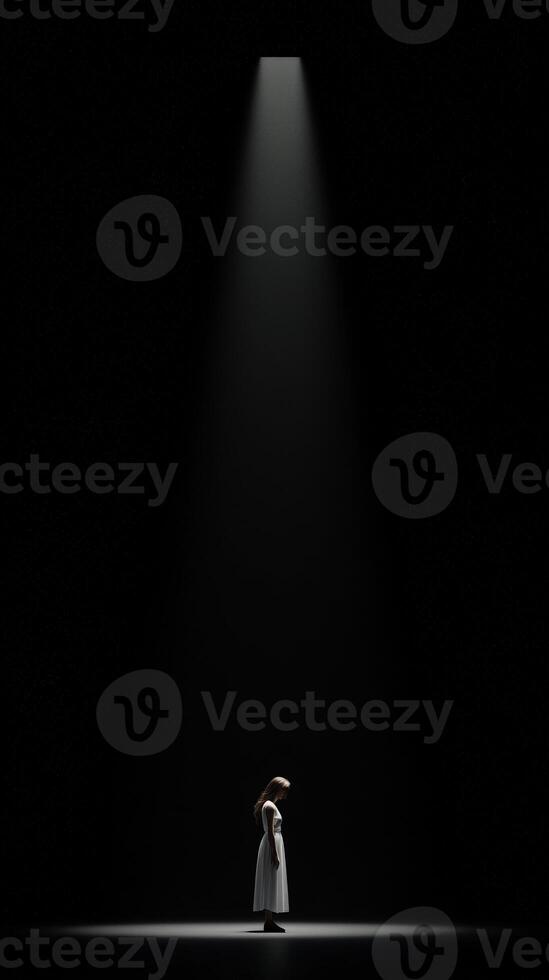 Light breaks through darkness highlighting a solitary figure in a performance photo