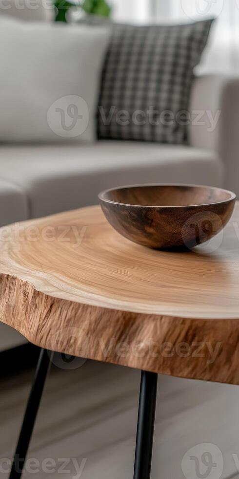 Modern wooden table with a bowl in a stylish living room setting photo