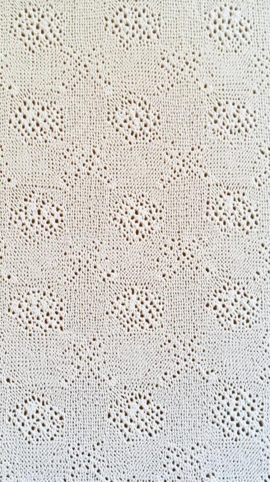 Intricate white lace fabric showcasing delicate patterns and textures photo