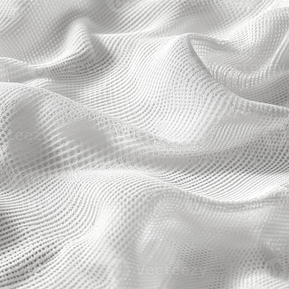 Delicate white fabric with intricate texture captured in soft lighting photo