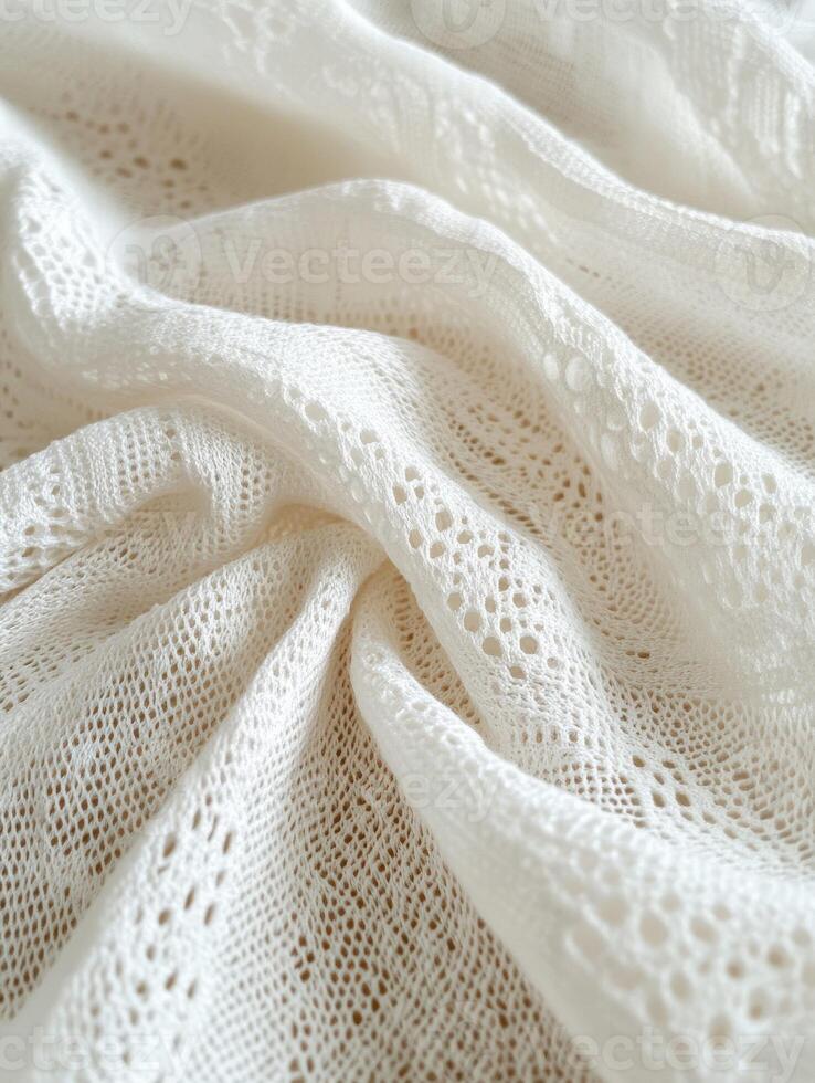 Delicate white lace fabric showcasing intricate patterns and textures photo