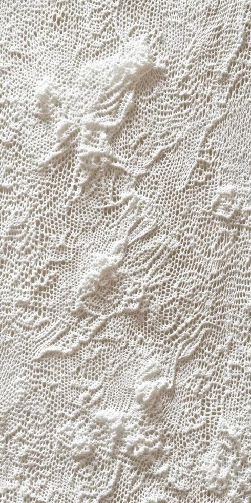 Delicate lace fabric with intricate patterns displayed for textile enthusiasts photo
