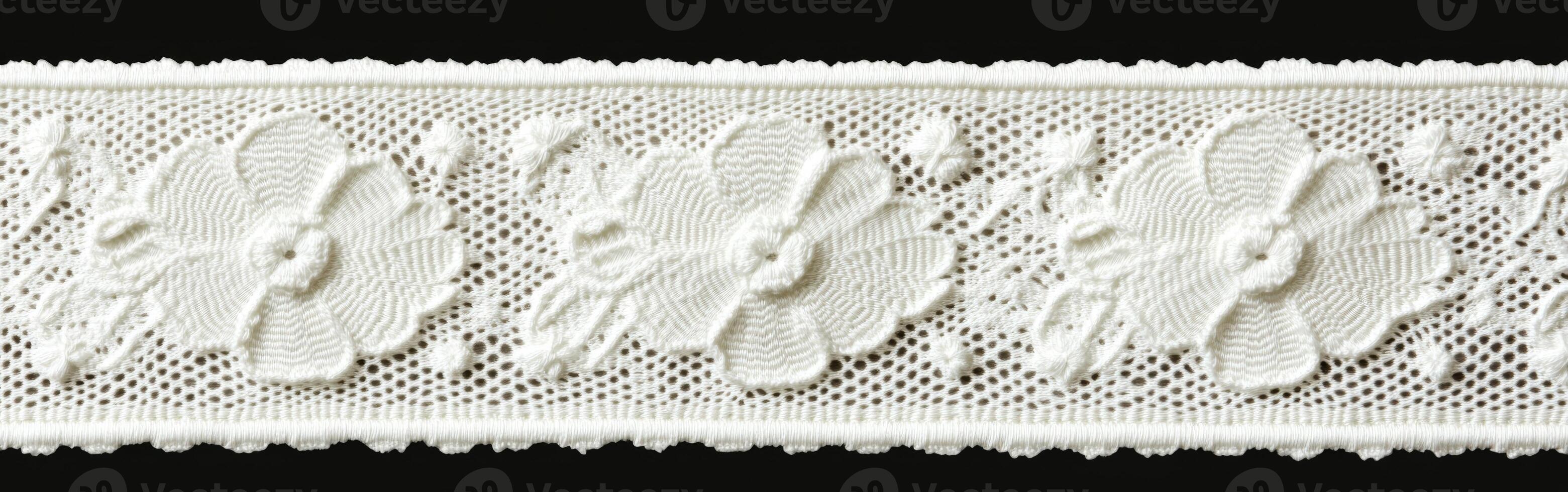 Decorative lace trim with floral patterns on a black background photo