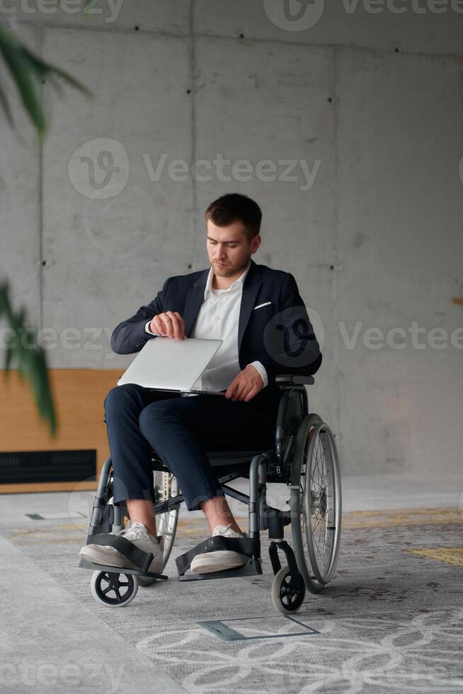 A director in a suit sitting in a wheelchair, using a ball in a modern office, embodying adaptability, focus, and leadership while navigating challenges in the workplace photo