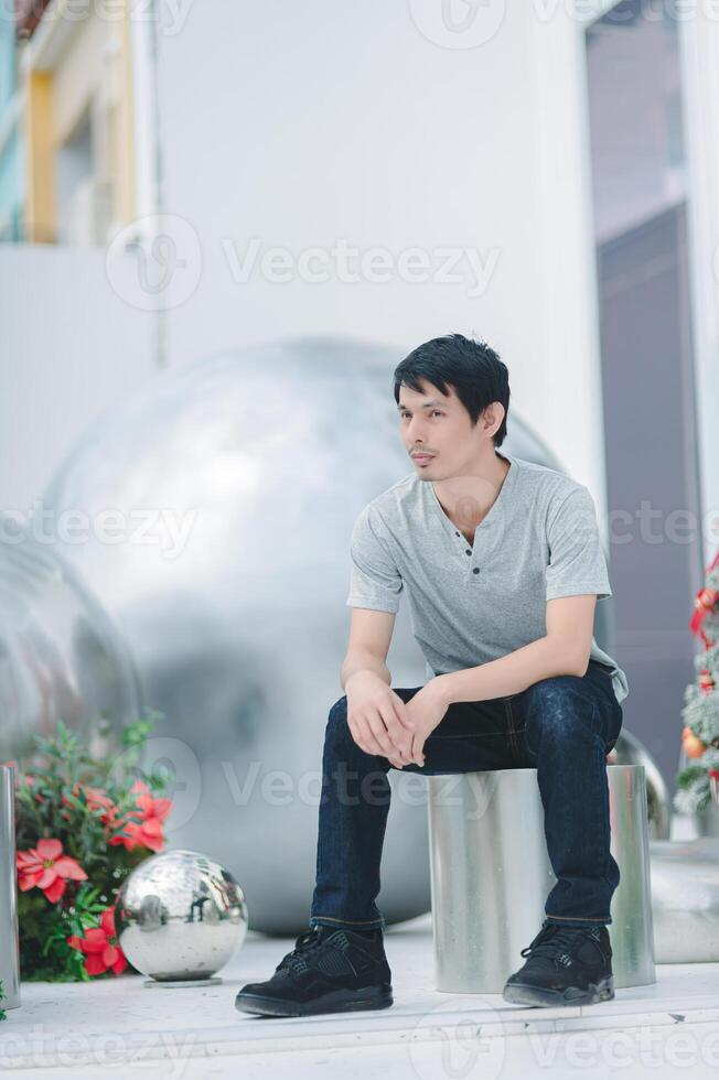 A man sitting on a bench photo
