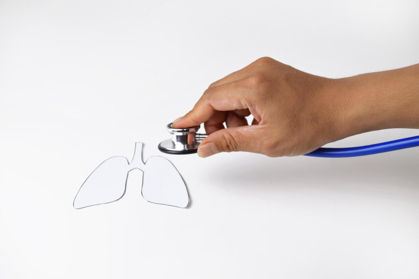 Medical Concept Hand with Stethoscope and Paper Lungs photo