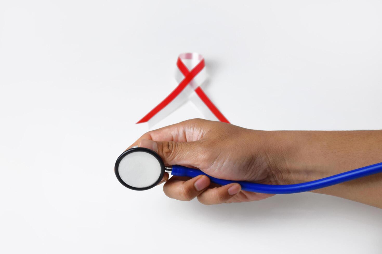 Healthcare Concept Stethoscope and Ribbon in Hand photo